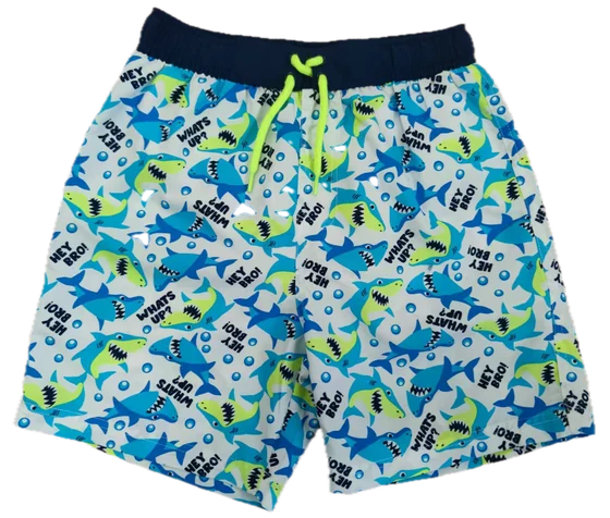 white swim shorts with blue-green cartoon shark print