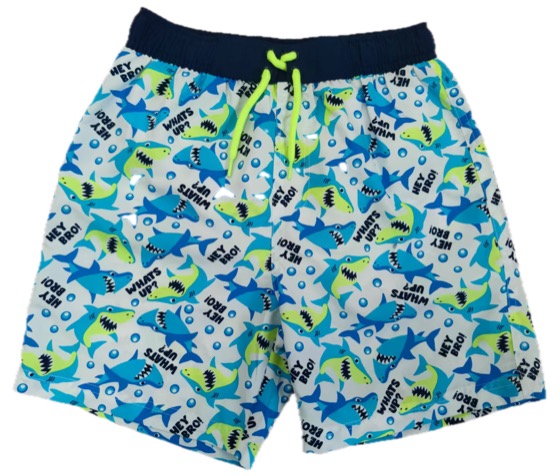 white swim shorts with blue-green cartoon shark print